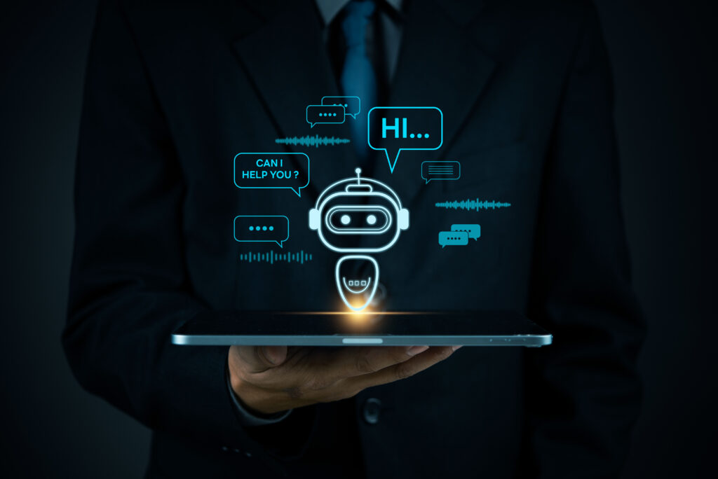 AI chatbot technology, virtual assistant for customer service, futuristic smart automation, AI-powered chatbot on tablet, digital business support, artificial intelligence conversation bot. A man holding a laptop with a chatbot and speech bubbles